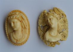 An oval carved ivory cameo of a lady's head togeth