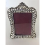 A stylish picture frame with embossed margin and s