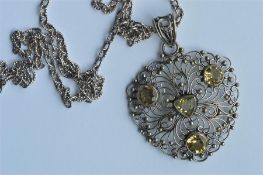 A stylish silver and citrine necklace / pendant wi