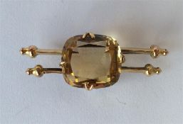 An Antique gold mounted citrine brooch in claw mou