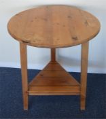 A small circular pine cricket table. Est. £80 - £1