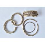 A selection of five Continental silver bangles. A