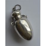 A small egg shaped scent bottle with screw-on cove