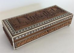 A carved Morocco cigarette box with ivory inlay de