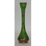 A stylish green glass vase with copper overlay and
