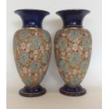 A tall pair of Royal Doulton vases with gilded dec