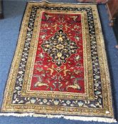 A colourful Eastern floral rug with red ground med