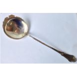 A large Continental silver gilt serving spoon, the