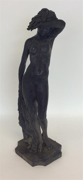 A limited edition sculpture of a naked lady with w