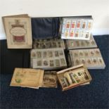 A large collection of old cigarette cards. Est. £3