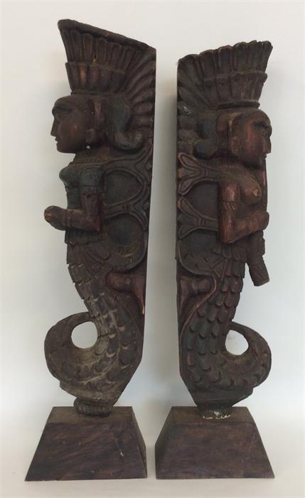 A pair of tall carved painted door stops of South - Image 2 of 2