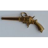 A small watch key in the form of a pistol. Est. £2