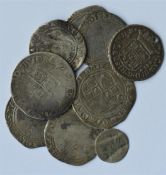 A bag containing early tokens and silver coins. Es