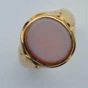 A 15 carat signet ring inset with cornelian. Appro