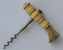 A turned Antique corkscrew with brush to side and