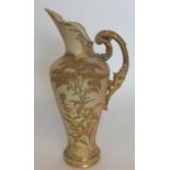 A Royal Worcester ewer with gilded decoration. Num