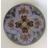 An attractive circular wall plate decorated with b
