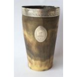 An Antique silver rimmed horn tumbler with crested