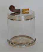 An unusual tobacco jar, the top mounted with a pip