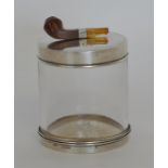 An unusual tobacco jar, the top mounted with a pip