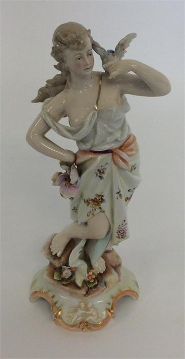 A figure of a lady with wavy hair. Est. £20 - £30.