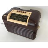 An old Bush Bakelite radio. Est. £30 - £50.
