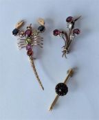 An Antique garnet brooch together with a gold gem