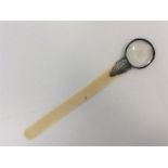A large ivory mounted paper knife / magnifier with