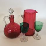 A selection of cranberry glassware.