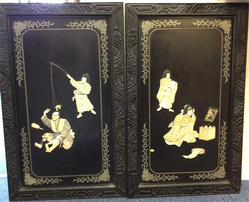 A good pair of large lacquered panels decorated wi