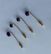 Four amethyst stone set stick pins. Est. £30 - £40