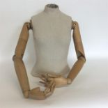 A good wooden mannequin with detachable limbs. Est