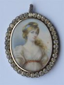 An attractive oval miniature on ivory of a lady wi