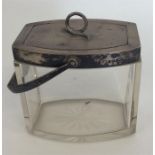 A silver and glass mounted biscuit box with swing