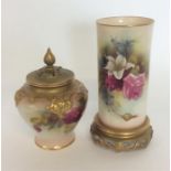 A tall Royal Worcester vase decorated with flowers
