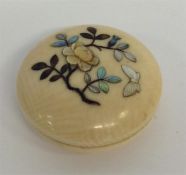 A small carved and inlaid Oriental ivory and MOP b