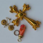 A small gilt cross together with a coral hand and