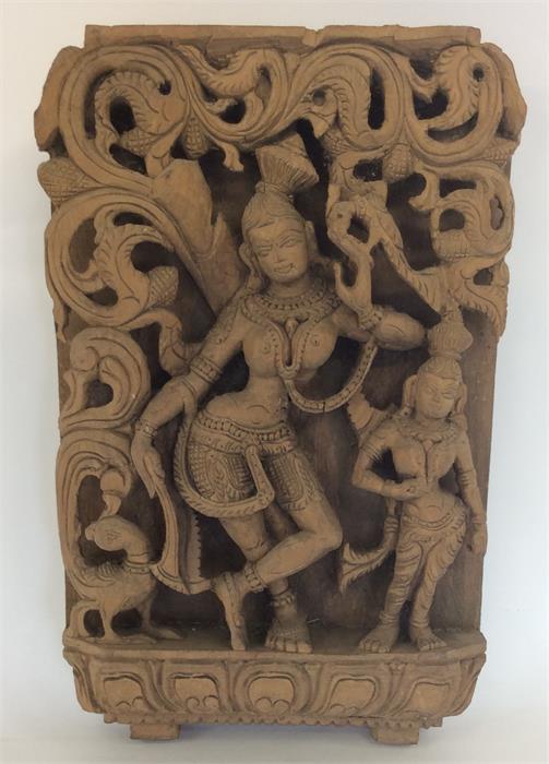 An unusual carved wooden plaque of a lady and chil