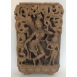 An unusual carved wooden plaque of a lady and chil