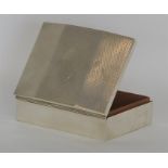 A large engine turned cigarette case with hinged t