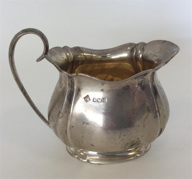 A good quality cream jug on spreading base. Sheffi