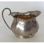 A good quality cream jug on spreading base. Sheffi