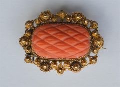 An Antique gold brooch with filigree decoration an