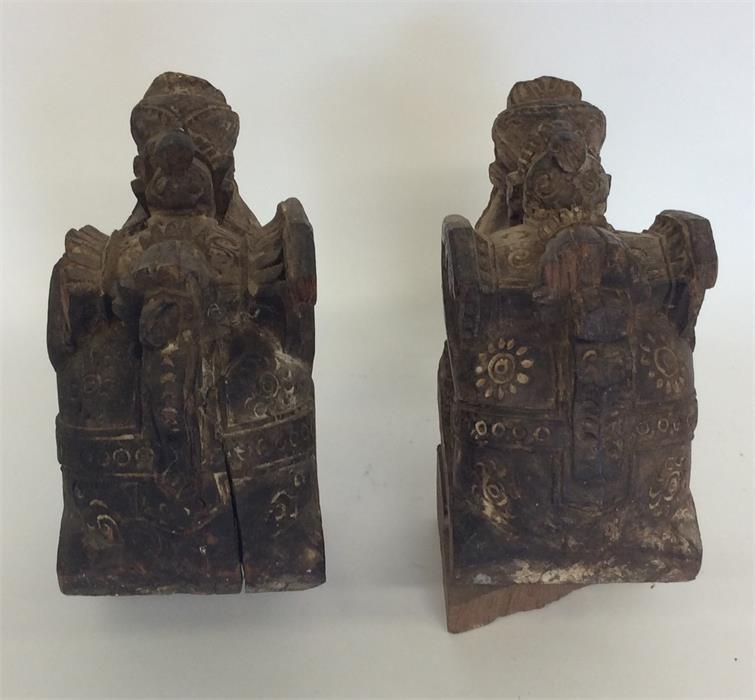 A pair of carved wooden figures of camels with tex - Image 2 of 2