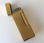 Dunhill: A boxed plated lighter with flip top toge