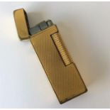 Dunhill: A boxed plated lighter with flip top toge