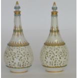 A pair of blue and white gilded vases of baluster