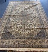 A large good quality silk rug with blue patterned