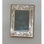 A Tiffany style picture frame of silver on copper