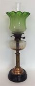 A large oil lamp with green glass shade. Est. £80